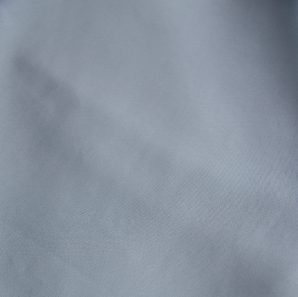 Close up of a baby blue polyester tablecloth.