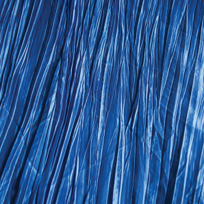 Close up of a blue crinkled accordion tablecloth.