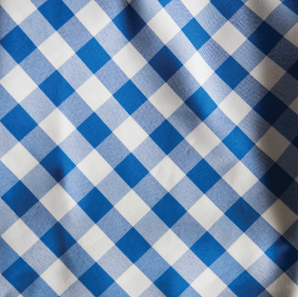Close up of a blue gingham check polyester tablecloth.