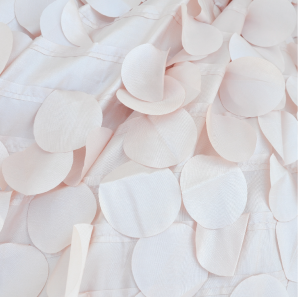 Close up of a blush petal tablecloth.