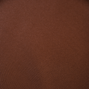 Close up of a chocolate brown colored polyester tablecloth.