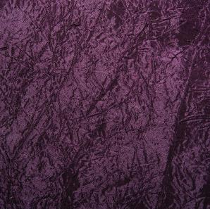 Close up of a eggplant crushed accordion tablecloth.