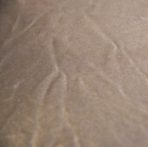 Close up of a metallic silver colored spandex tablecloth.