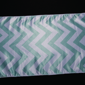 Close up of a mint chevron table runner.