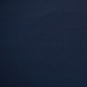 Close up of a navy blue spandex tablecloth.