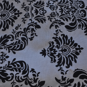 Close up of a silver black patterned overlay.