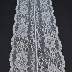 Close up of a white lace table runner.